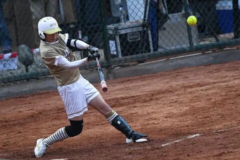 Saki Yamazaki bats during the women's softball final between Japan and...