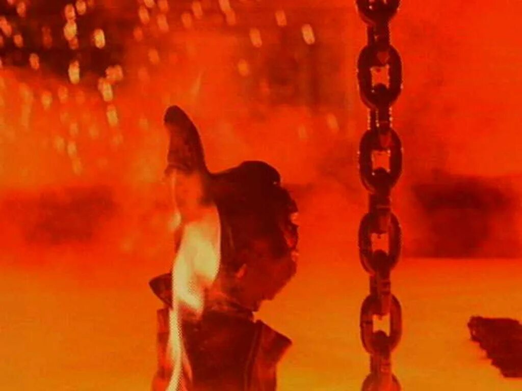 Терминатор 2 большой палец. Терминатор погружается в лаву. Терминатор 2 палец вверх. Терминатор 2 последняя сцена. Терминатор 2 большой палец.