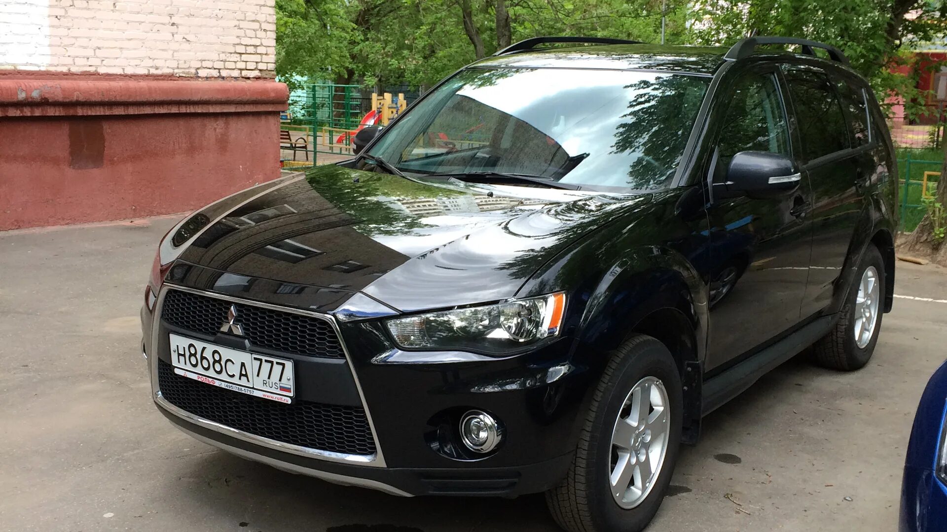 Мицубиси аутлендер хл 2008 года. Mitsubishi Outlander XL 2012. Mitsubishi Outlander XL 2012 2.4. Mitsubishi Outlander XL 2012 черный. Митсубиси Аутлендер XL 2.4 2011.