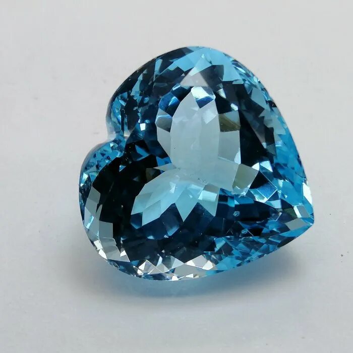 Топаз лондон блю. Сапфир лондон блю. Серебряные украшения с цирконием. Топаз индиго. Уральский топаз.