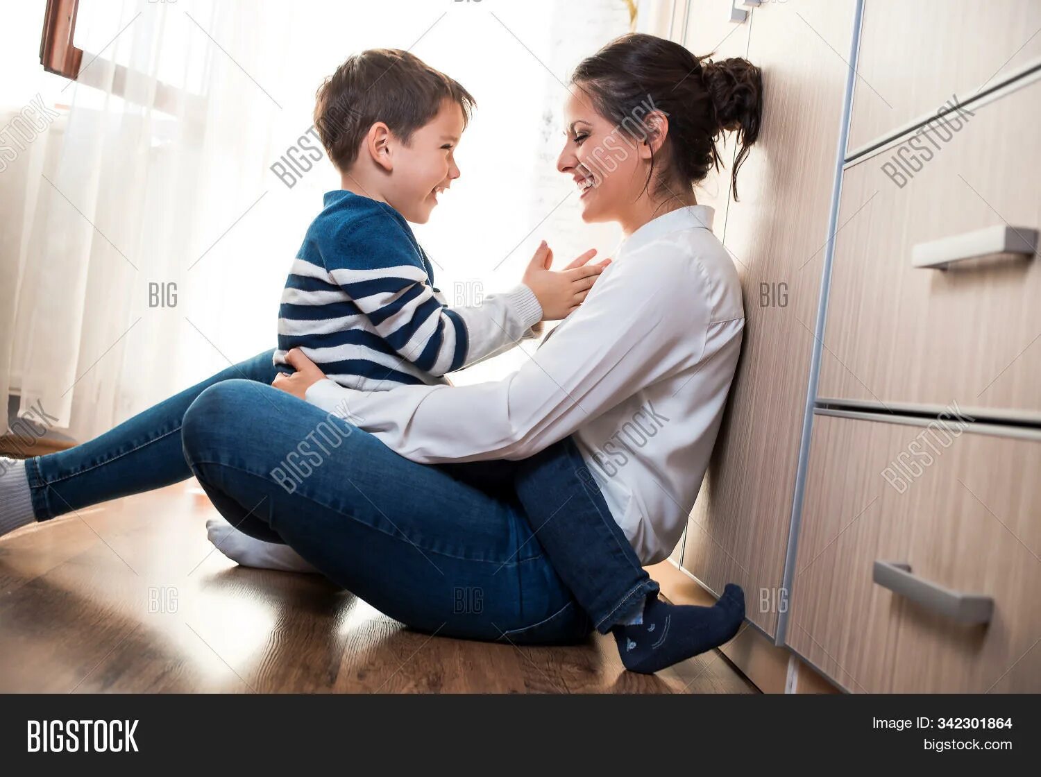 Mother sitting sons lap. Mother sitting on sons lap. Son on mother's lap. Sitting on son lap.