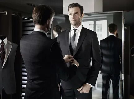 A Client getting fitted for a made to measure suit.