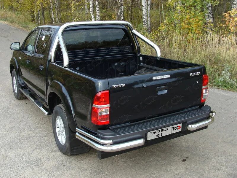 Toyota Hilux 2010 кузов. Защитная дуга бампера Тойота Хайлюкс 2014. Дуги в кузов Тойота Хайлюкс. Защита кузова Тойота Хайлюкс.