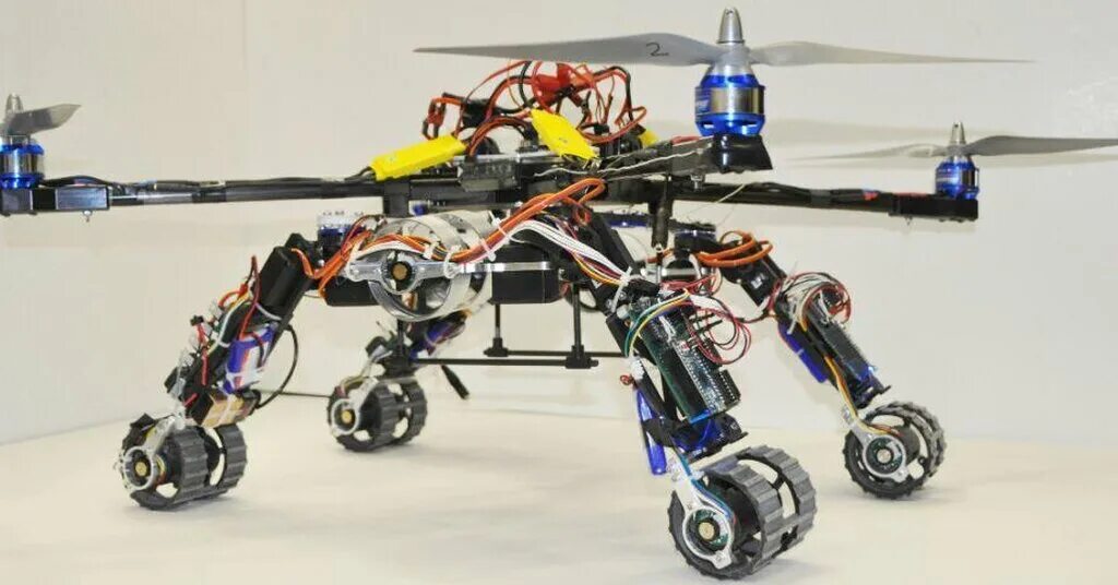 Роботы какого класса могут быть летающими шагающими. Дрон-гибрид. delta h 1600. гибридные роботы. колесные мобильные роботы. квадрокоптер робототехника.