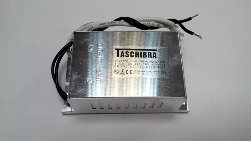 Эл трансформатор. Трансформатор электр.taschibra tra25 12v-150w. трансформатор taschibra 150w 22012v. трансформатор tashibra 105w12v. блок питания taschibra 12v 105w.
