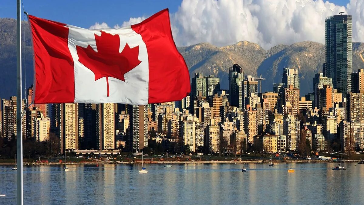 Площадь канады больше китая. Флаг Канада. Флаг Канады фото. Канада красивые места с флагом. Канада картинки для презентации.