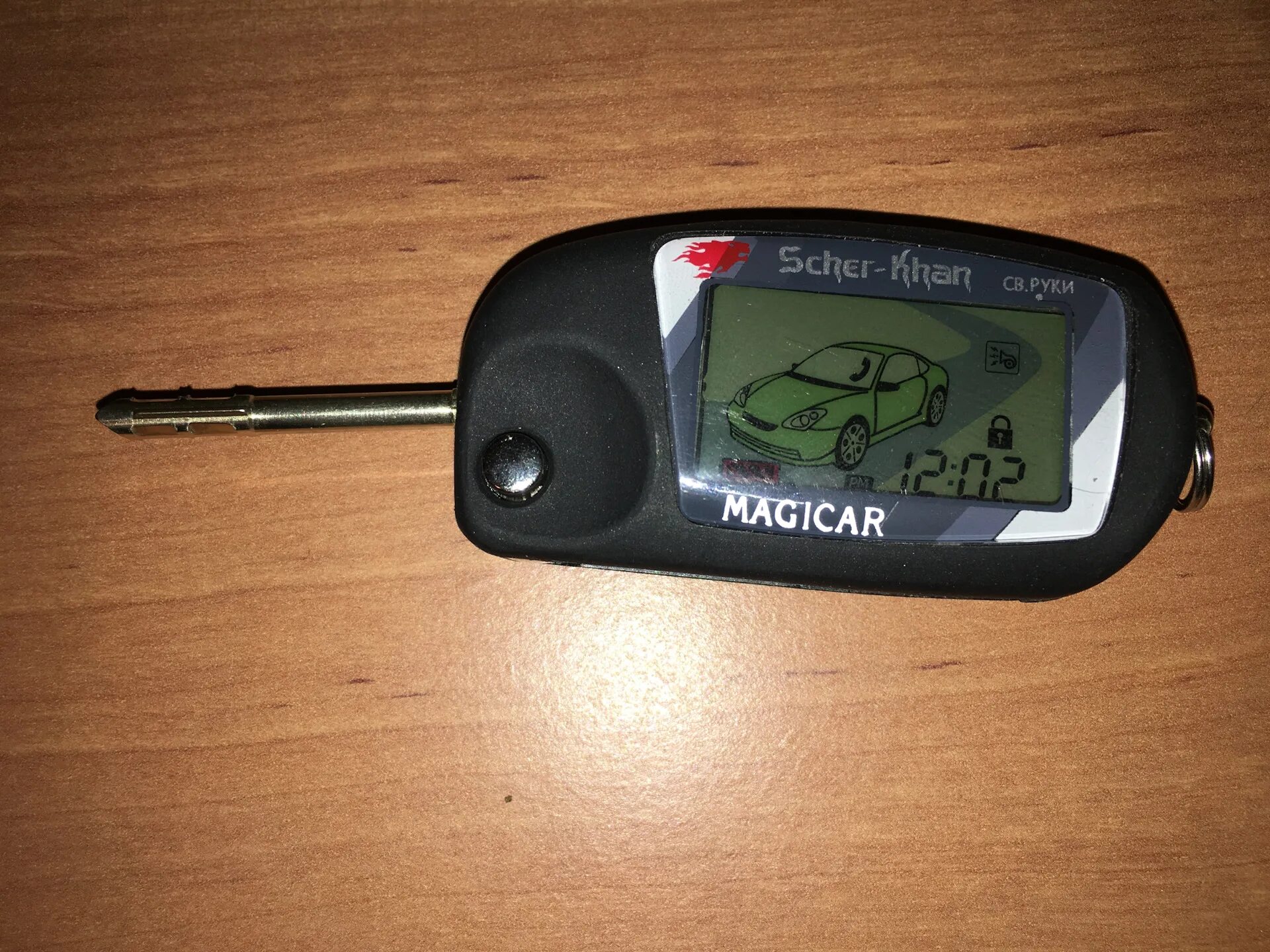 Пульт сигнализации scher-khan magicar. Сигнализация scher-khan logicar 2 (с автозапуском). Sher khan mobicar b v2. Брелок scher-khan magicar 2. Scher-khan mobicar а v 2.