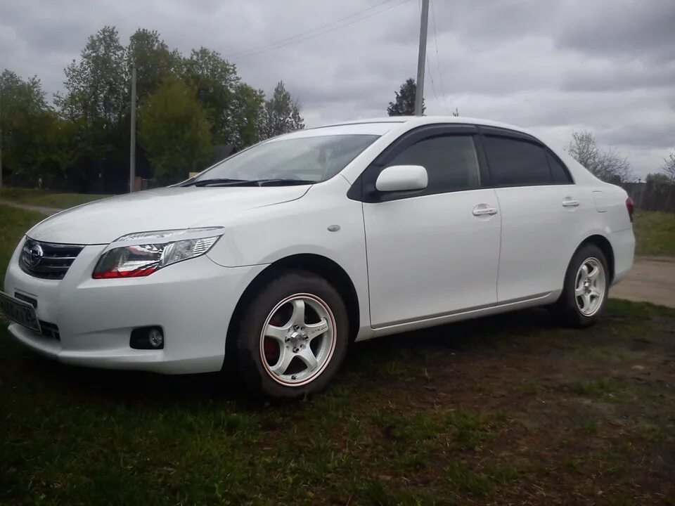 Продажа тойота королла аксио. Тойота Королла Axio. Toyota Axio 2010. Тойота Королла Аксио 2010 года. Toyota Corolla Axio e140.