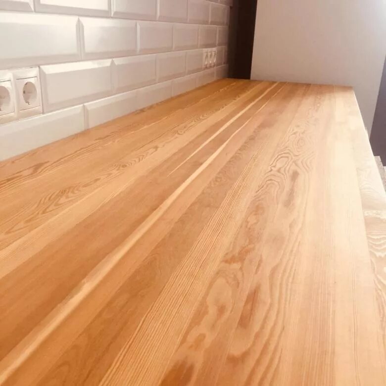 This cypress kitchen island countertop is heavily wire brushed to create a raise