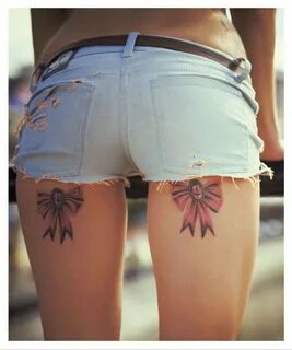 Ribbon tattoos on back of thighs