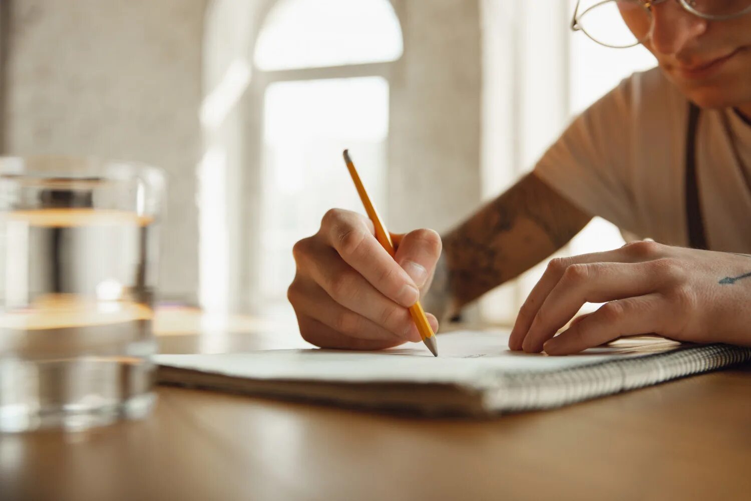 Writing a Letter. Writing hand and paper. Handmade writing. Beauty writing on the Table.