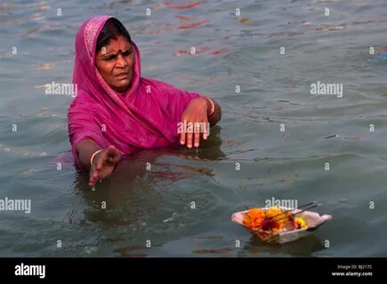 India, Uttar Pradesh, Prayagraj (Allahabad), Sangam, woman bathing at the c...