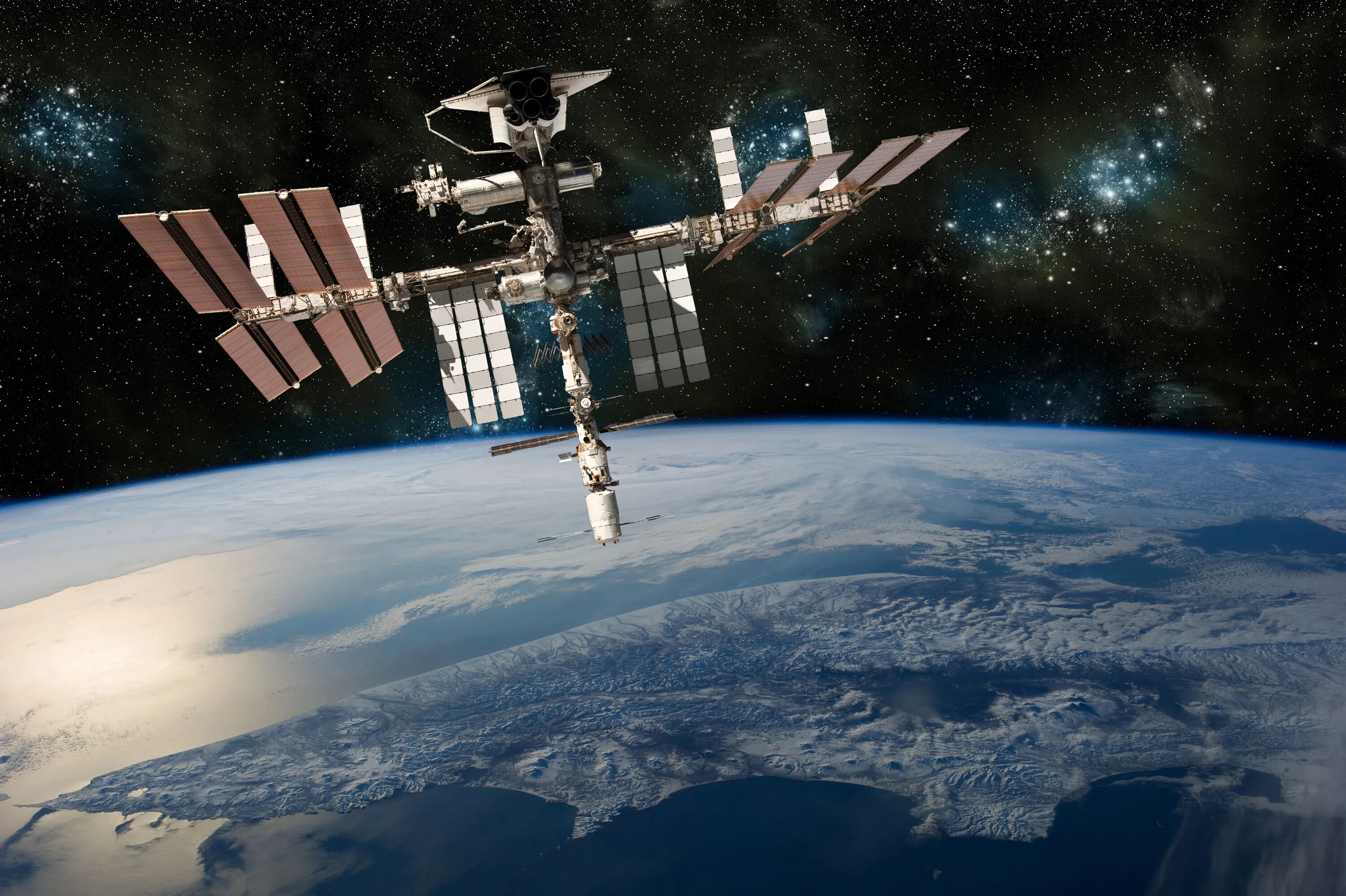 Первая космическая станция на орбите. Международная Космическая станция МКС. Международная Космическая станция ISS. Космическая орбитальная станция МКС. МКС 2000.