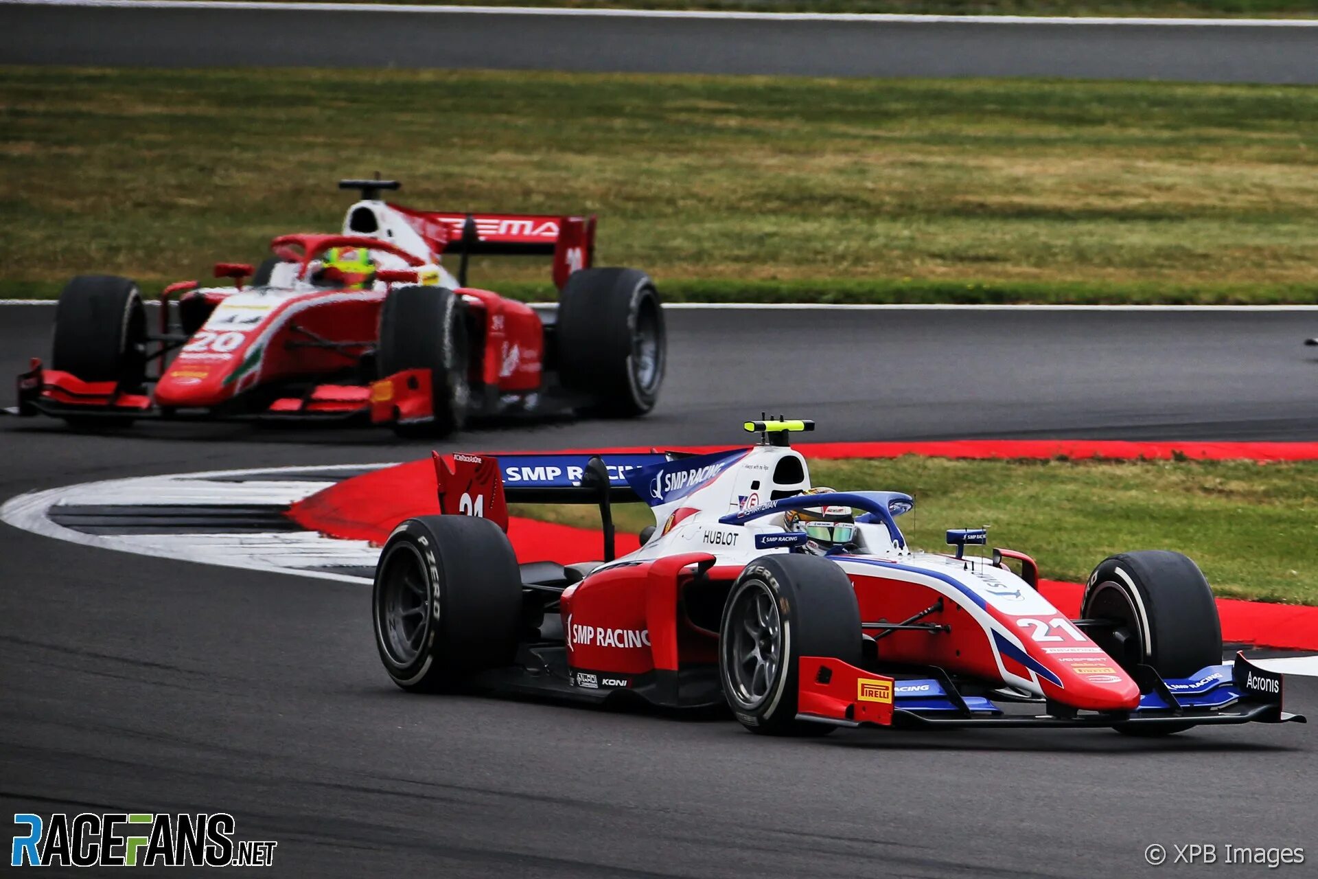 Junior ferrari. Хаас ф1 2018. Формула 2 Сильверстоун Шумахер и Шварцман. Ferrari f1. Королева автоспорта формула 1.