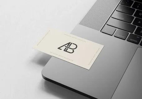 Free Business Card on MacBook Pro Mockup (PSD)