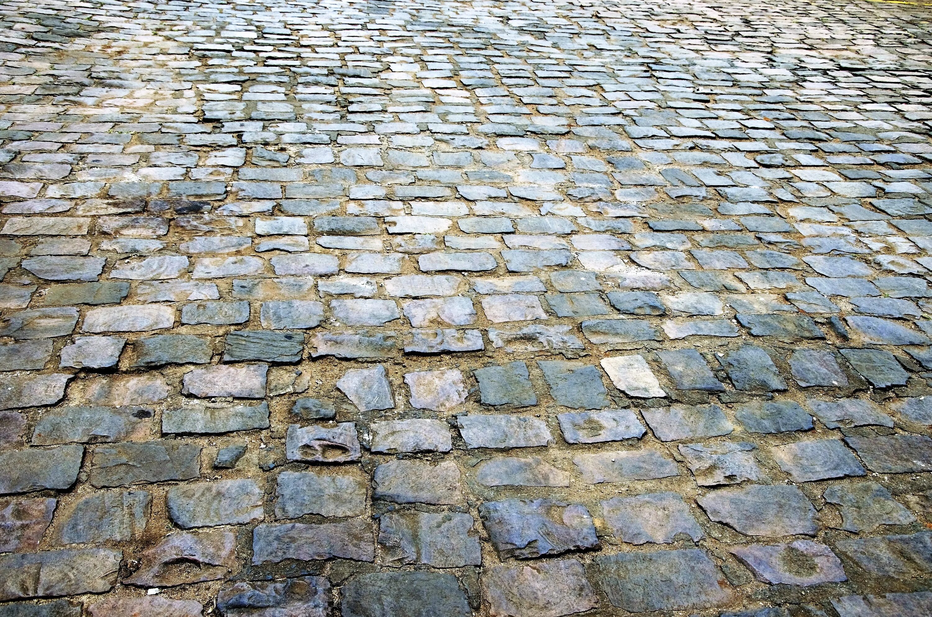 Ground stone. Плитка булыжная Мостовая. Плитка тротуарная "каменная Мостовая". Тротуарная плитка "мостовой камень". Мощенная булыжником Мостовая.