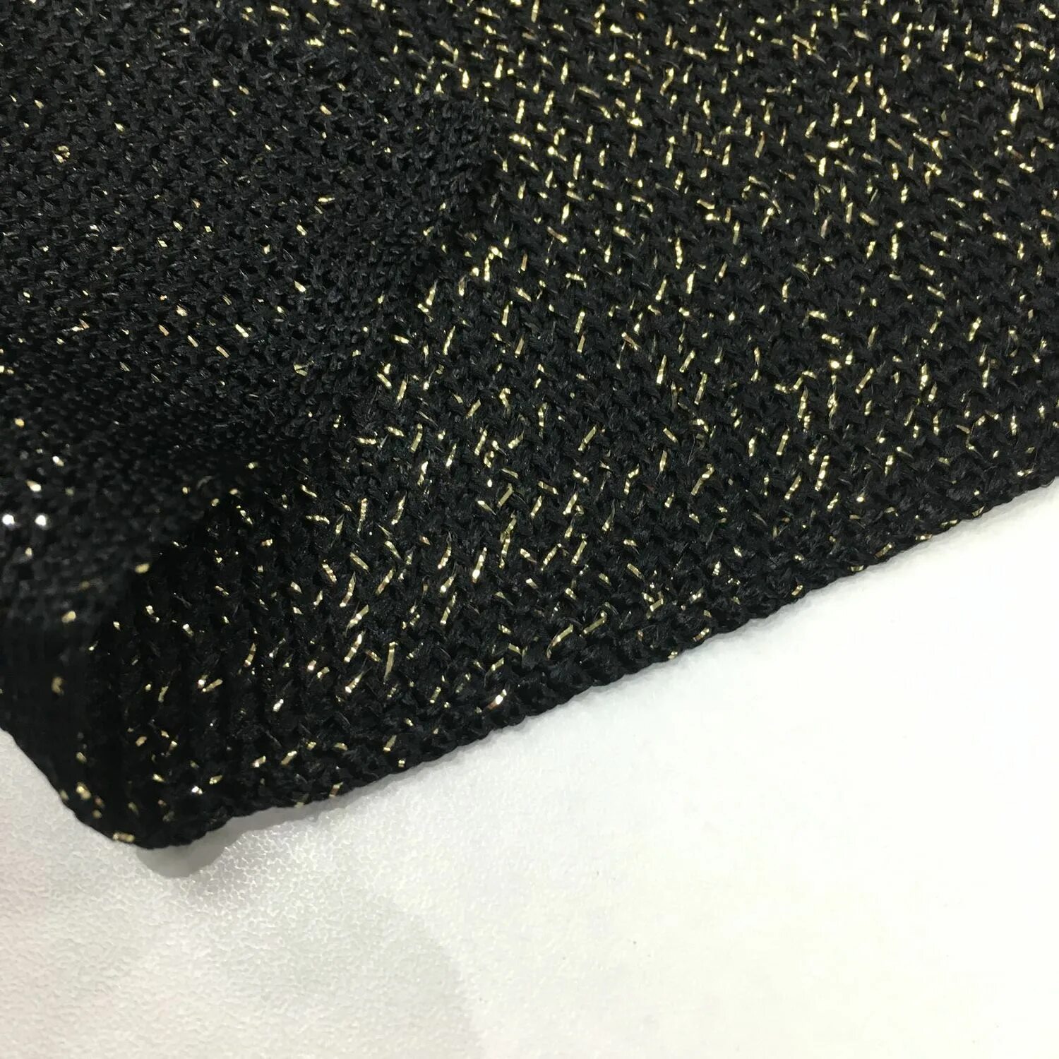 Резинка для манжет фенди. Темная ткань текстура. Черная шелковая пряжа. Свитер. Текстура ткани.