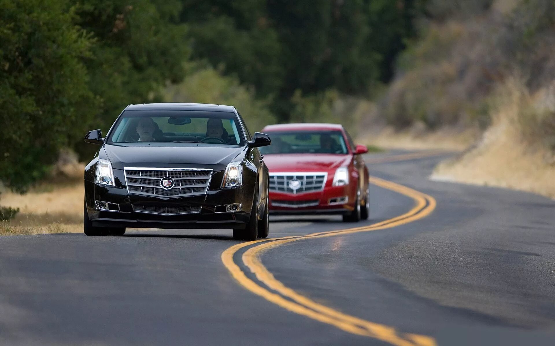 The car on the left is. Cadillac CTS. Cadillac CTS обои. Cadillac CTS 2008 на рабочий стол. Cadillac CTS V Wagon.