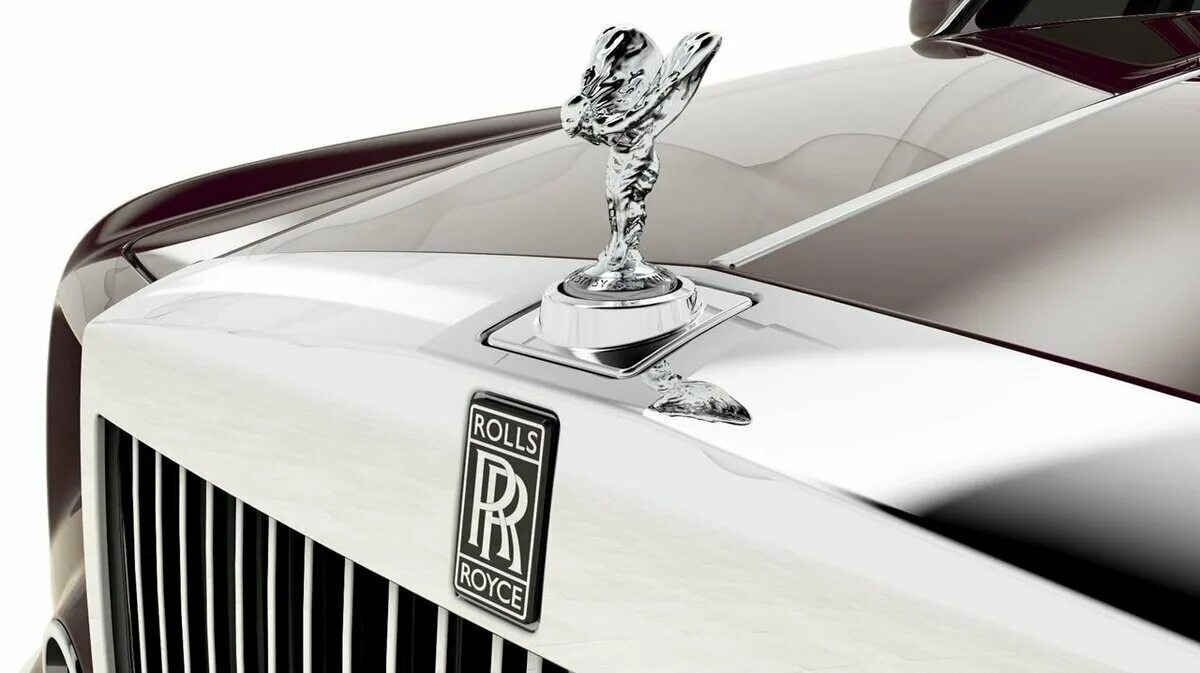 Значки на капоте машины. Rolls Royce дух экстаза. Маскот Роллс Ройс. Статуэтка Роллс Ройс.