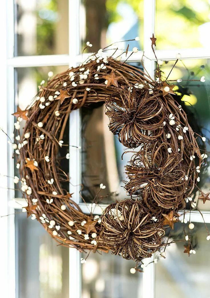 A closer view, this eco-chic chandelier is made with hanging wooden and moss bal