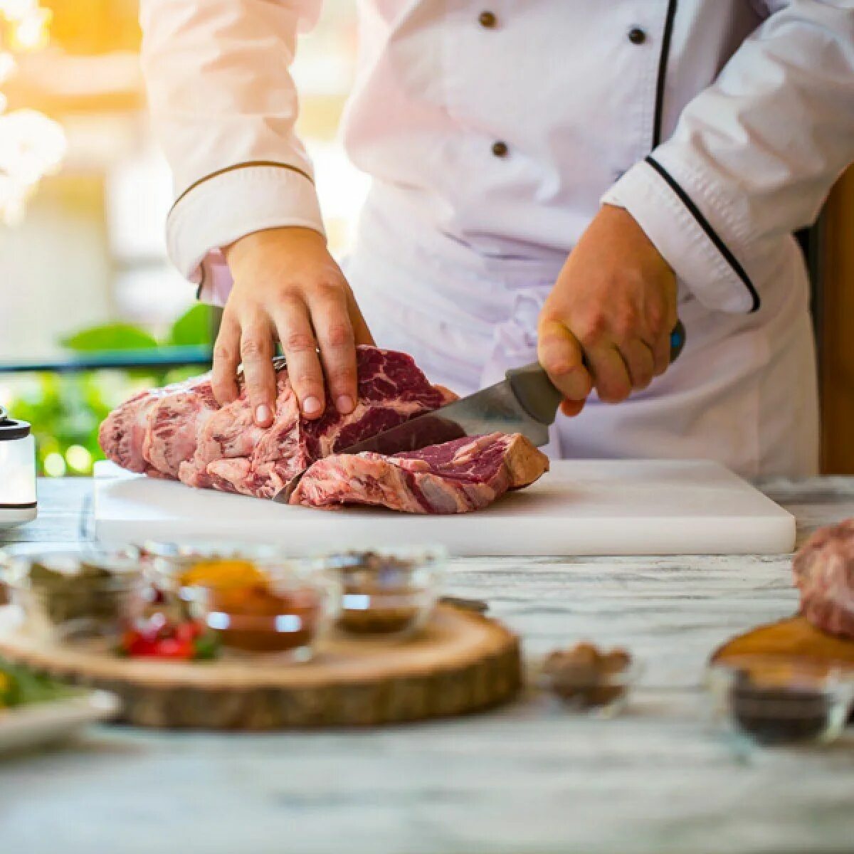 Meat cutting. Meat Butcher in Kitchen. Cut meat in Squard. Cheep meat hand.