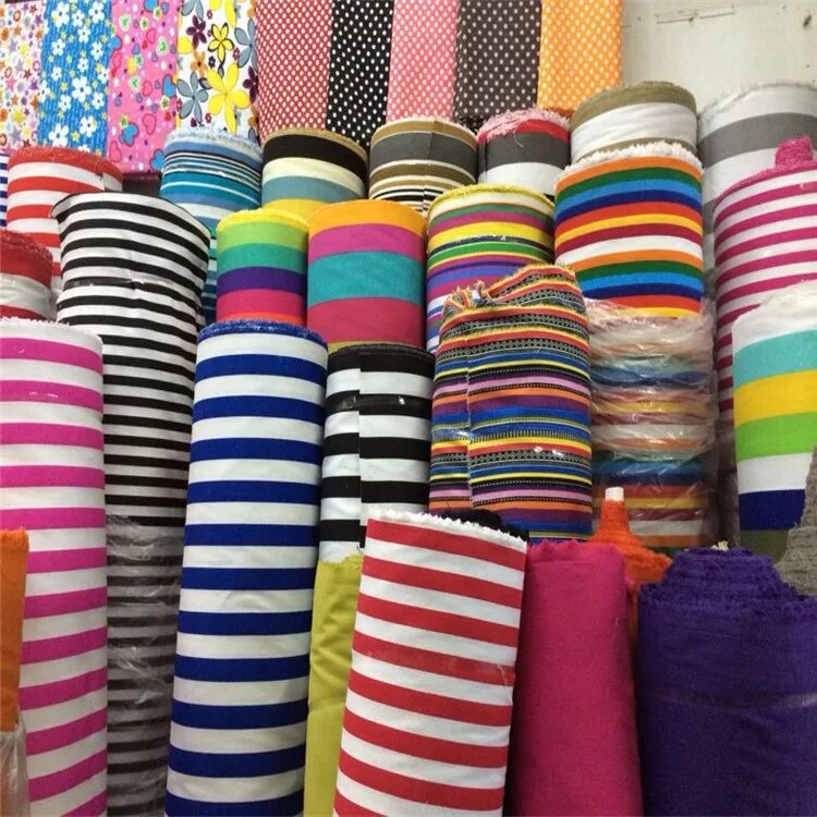 трикотажная ткань. рулоны ткани трикотаж. ткань трикотаж оптом. детский хлопок ткань. кулирка в стопке.