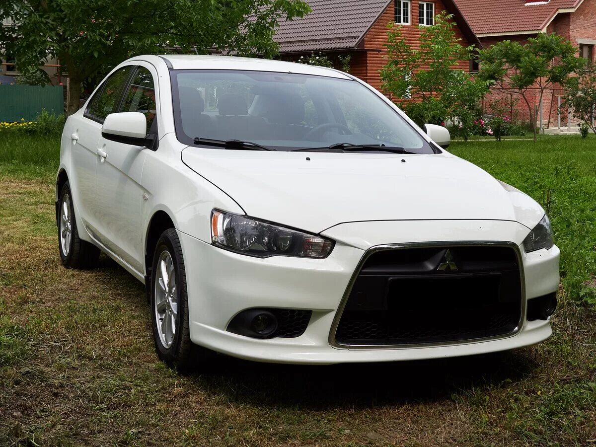 Лансер 10 б у. Лансер 10 Рестайлинг. Mitsubishi Lancer 2014 белый. Митсубиси Лансер 10 Рестайлинг. Mitsubishi Lancer 10 Restyling.