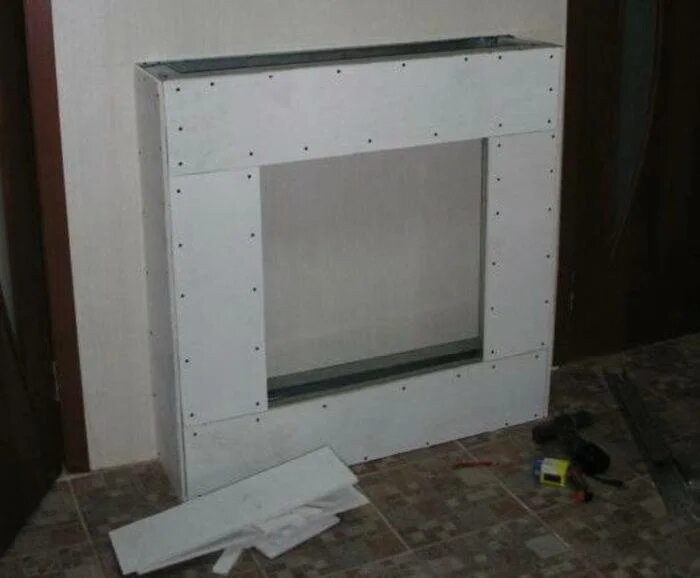 Фальш из гипсокартона. Каркас для электрокамина из гипсокартона. Ниша под телевизор из гипсокартона. Фальш из гипсокартона. Стенка из гипсокартона под телевизор.