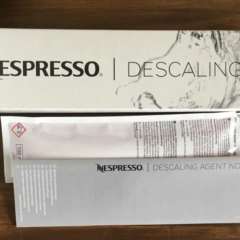 Nespresso очистка от накипи. Неспрессо Descaling. Набор для очистки от накипи Nespresso. Средство от накипи для кофемашины неспрессо. Очистка кофемашин неспрессо от накипи.