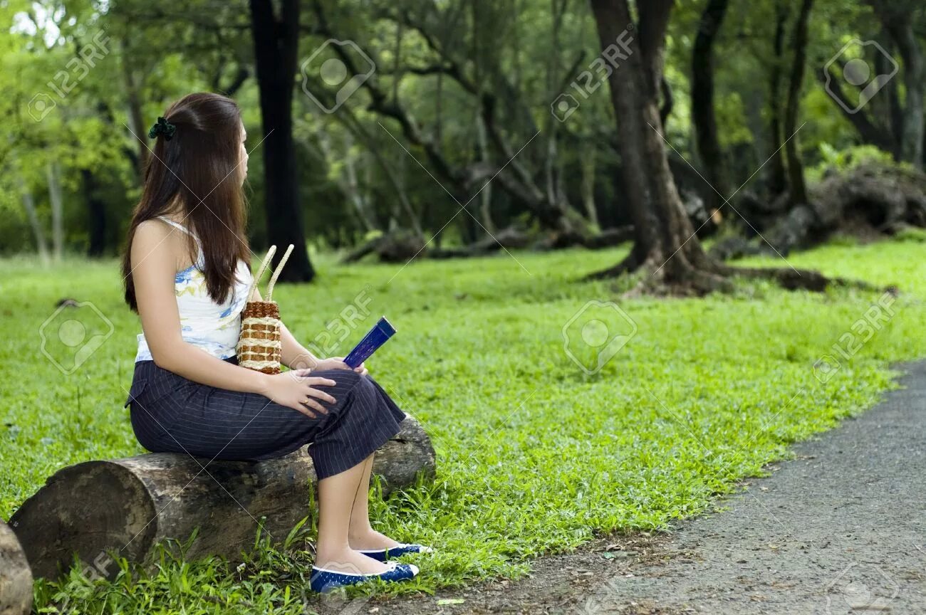 Waiting for host. Waiting at the park. girl is at the park. sitted. waiting for somebody.