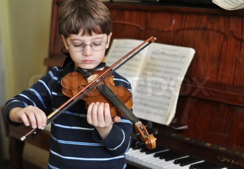 My brother played the violin. The boy is playing the Violin.