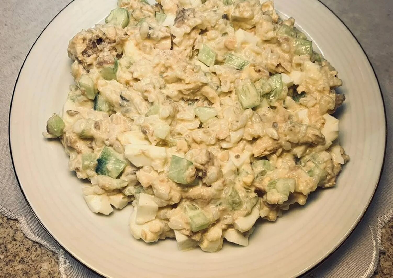 A simple but delicious salad with canned pink salmon. It is laid out in layers i