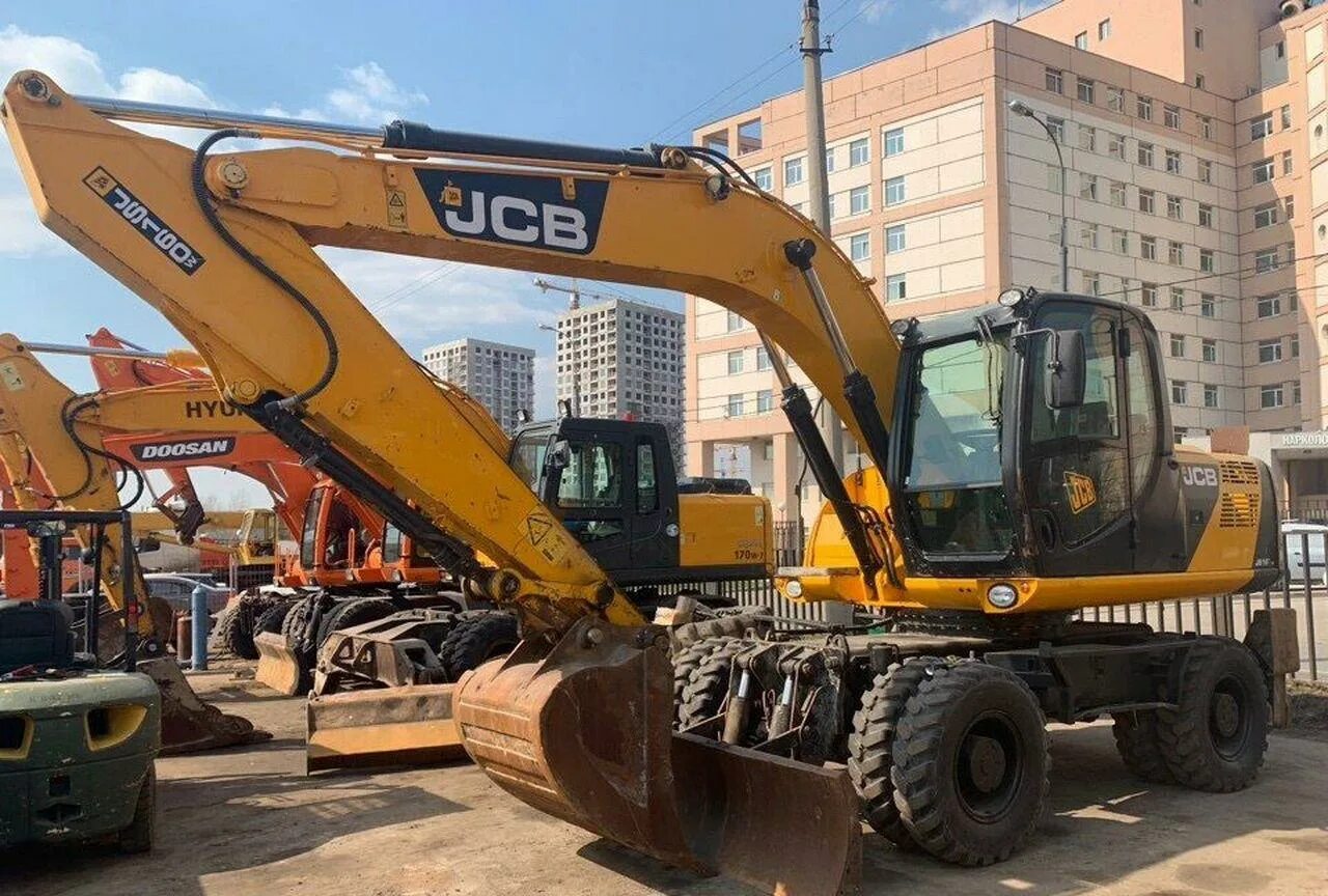 Купить экскаватор бу полноповоротный. JCB 160 колесный. Экскаватор JCB js160w. JCB 160w колесный экскаватор. Колесный полноповоротный экскаватор JCB js160w.