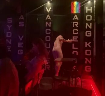 Cute stripper finishing a nude lapdance. 