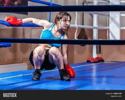 girl boxer in boxing ring in professional female boxing.