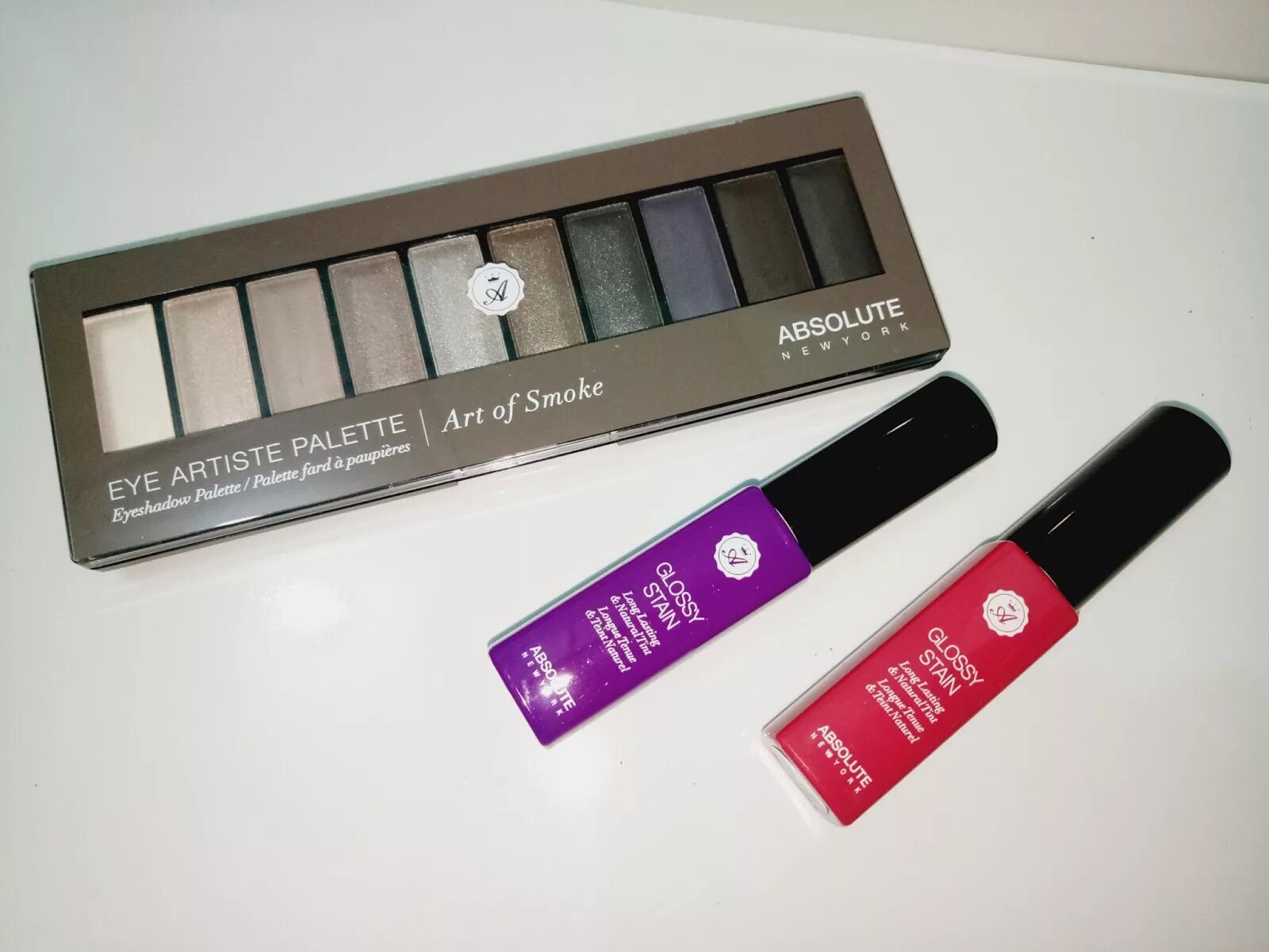 Absolute new york. Absolute new york glossy stain. absolute new york glossy stain свотчи. палетка теней absolute new york eye artiste palette. absolute new york rosewood.