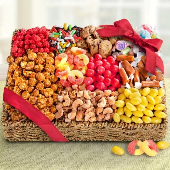 Basket of Sweet snacks. Cartoony Sweets Basket. Composite images of Fruit, Water, and Sweets in Baskets taken indoors.