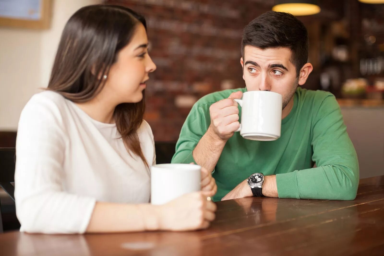Mike usually to drink. The man drinking coffee with alone background. friends are talking.