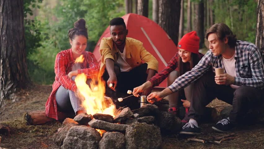 Camping Marshmallow. Sitting Alone around the Campfire. Halftone Effect people sitting around a Campfire.