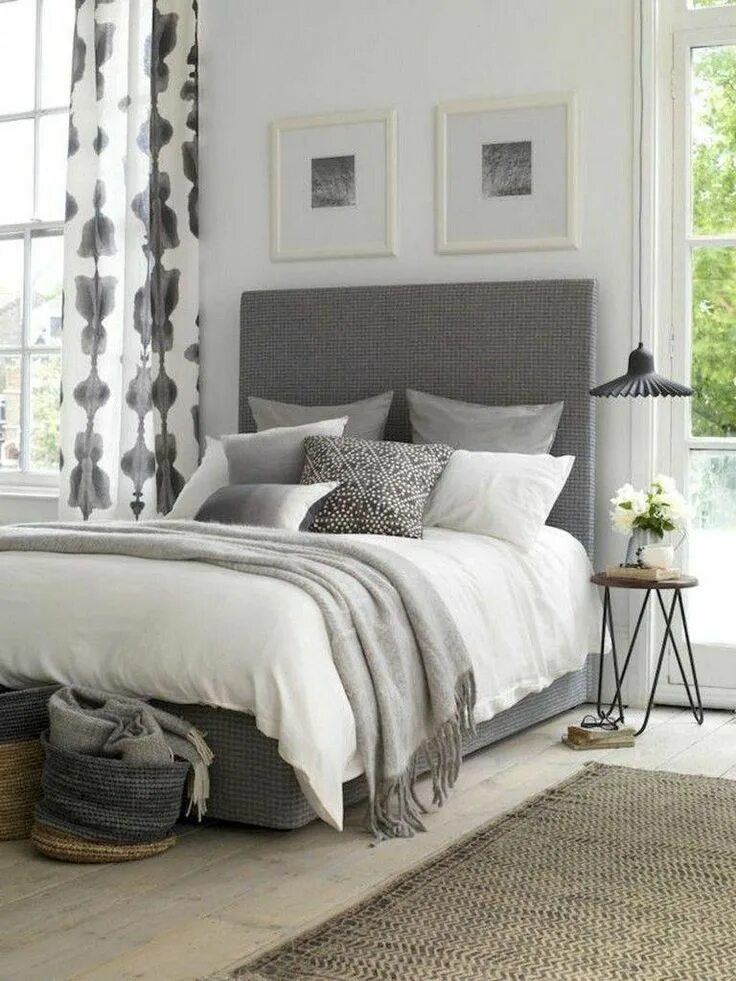 Modern bedroom with grey upholstered bed and soft furnishings Grey bedroom desig