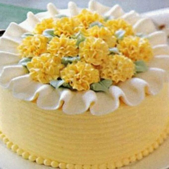 Украсить торт мимоза. Украшение торта Мимоза. Торт украшенный мимозой. Желтый торт с цветочками. Торт с желтыми цветами из крема.