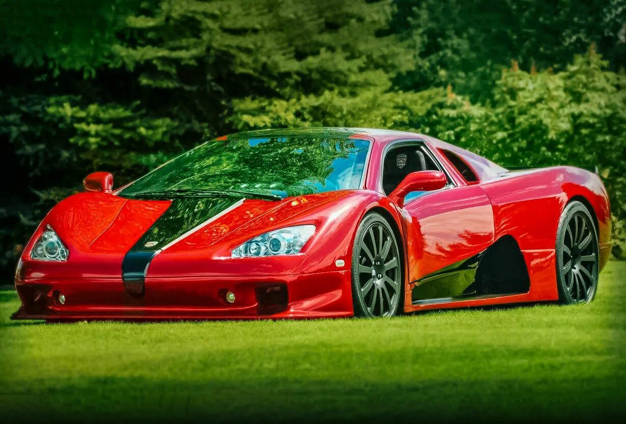 Ssc ultimate aero 2006. Bugatti veyron 16. Автомобиль bugatti veyron 16. Бугатти вейрон супер спорт. Бугатти вейрон суперспорт.