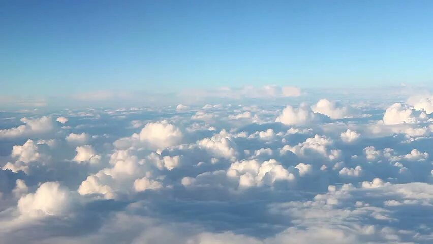 Dawn Sky view of plane. Air Footage. Plane Flying through cloud Top view.