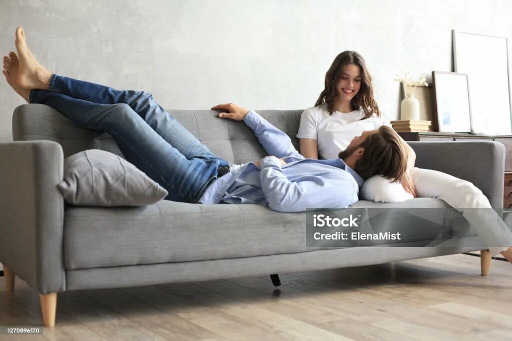 Go on the couch. Жена на диване. with soccer early together sofa.