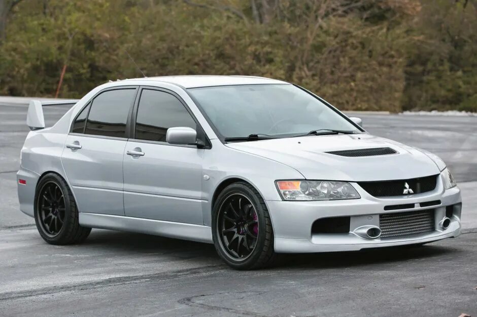 Evo tl. Mitsubishi Lancer EVO IX. 2006 Mitsubishi Lancer Evolution IX Mr. Mitsubishi Lancer and Lancer Evolution 9. Митсубиси Лансер Эволюшн 2006.