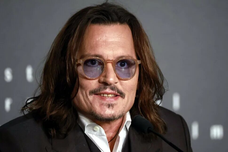 Johnny Depp slams Hollywood as a 'racket' as he reveals his secret hideaway for 