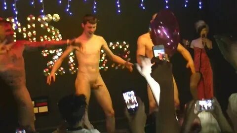 Naked male on stage.