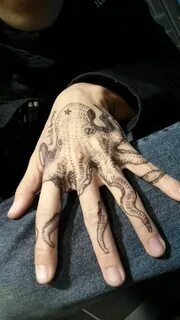 Octopus finger tattoo