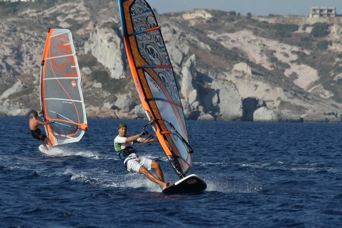 Complete the exchanges he is on windsurfing