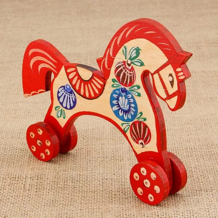 городецкие деревянные игрушки. городецкая игрушка 19 век. городецкая роспись лошадка качалка. конь каталка городецкая роспись. народные промыслы:игрушки городецкая роспись.